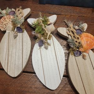 a 3 piece set of wooden fish wall hanging
